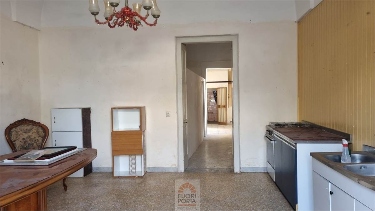 Entrance-living room with open kitchen